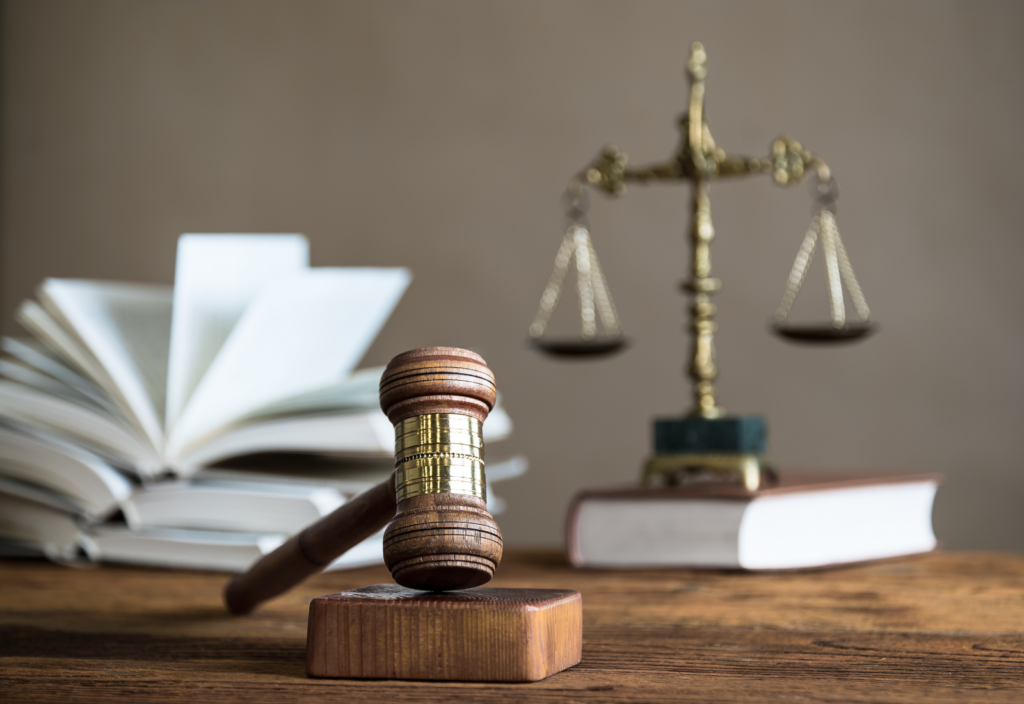 Image of a gavel and the scales of justice on a desk