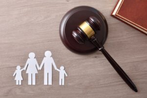 Family law image of a gavel and a family made of paper dolls on Blackford & Flohr's website