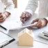 Image of two people consulting over estate planning documents at a desk