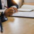 Image of attorneys consulting at a desk