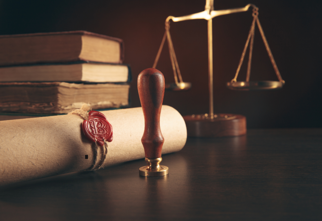 Image of a document, a gavel, and a stamper