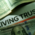 Image of a document reading Living Trust with cash on top